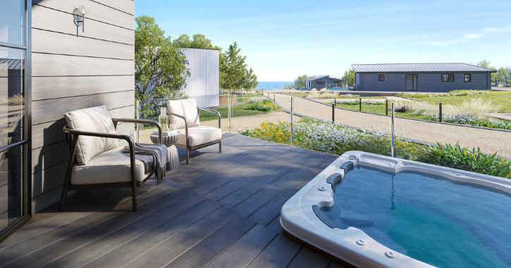 View from the private decking of a coastal cabin at Seaham Hall Hotel with the durham heritage coast in background.